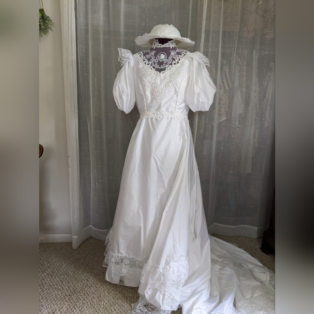 Romantic lacey wedding gown from Bridallure by Alfred Angelo